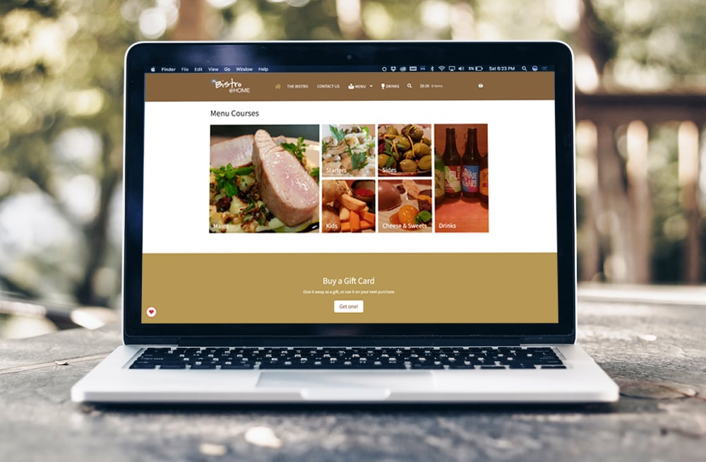 Responsive, Tauranga digital design agency. Client project  - The Bistro @ Home, Website development, eCommerce, web hosting, The Bistro @ Home menu courses on homepage on a laptop