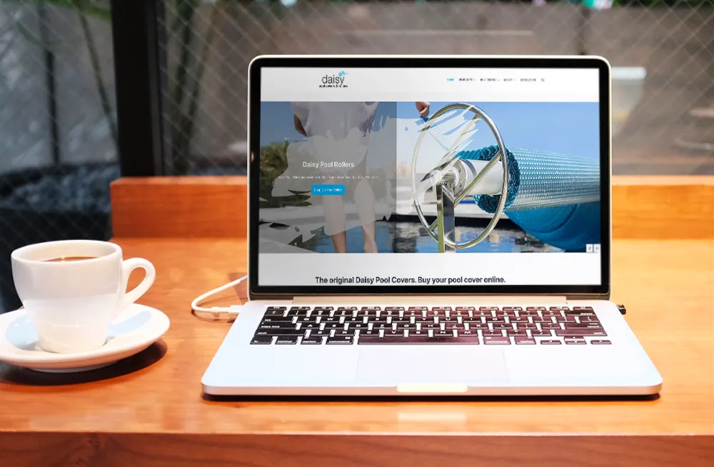 Responsive, Tauranga digital design agency. Client project  - Daisy Pool Covers & Rollers, Website development, web hosting, Daisy Pool Covers and Rollers - homepage slider on laptop