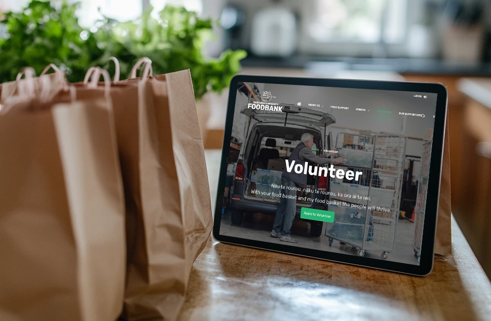 Responsive, Tauranga digital design agency. Client project  - Tauranga Community Foodbank, Website development, web hosting, Tauranga Community Foodbank - volunteer page on a tablet